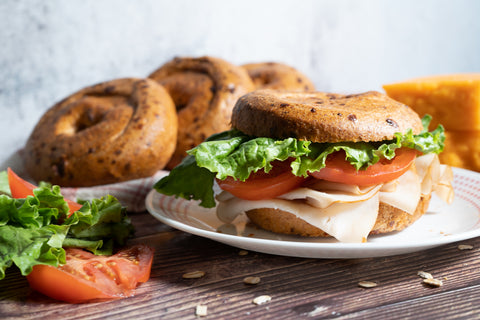 Gluten-free bagel sandwich prepared with Outside The Breadbox bagels in a casual dining setting
