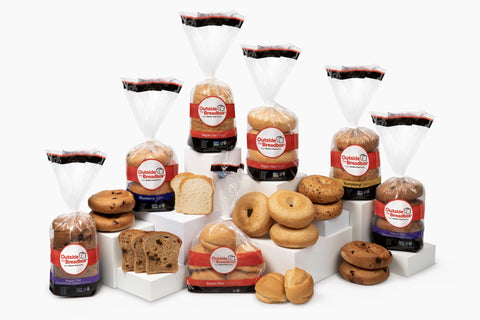 Family lineup of gluten-free breads, bagels, and rolls from Outside The Breadbox