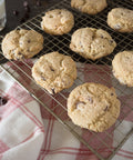 Gluten-free chocolate chip cookies from Outside The Breadbox cooling on a rack