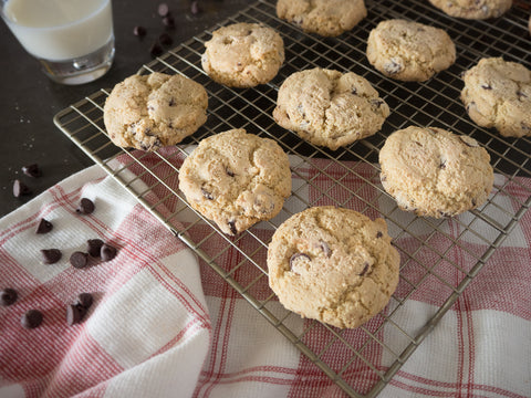 Gluten-free chocolate chip cookies from Outside The Breadbox cooling on a rack