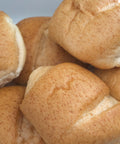 Close-up of gluten-free oat dinner rolls from Outside The Breadbox showing golden crust and shape