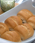 Gluten-free oat dinner rolls from Outside The Breadbox arranged in a serving dish
