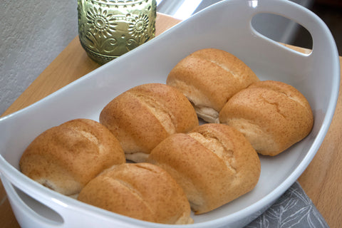 Gluten-free oat dinner rolls from Outside The Breadbox arranged in a serving dish