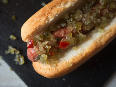 Gluten-free hot dog bun from Outside The Breadbox filled with a hot dog and relish